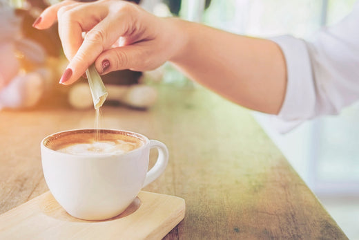 closeup-lady-pouring-sugar-while-preparing-hot-collagen-coffee-cup