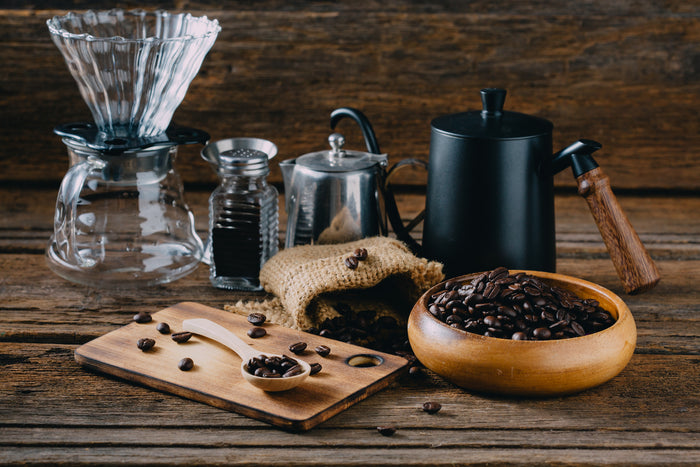coffee-beans-with-accessory-drip-coffee-wooden-table