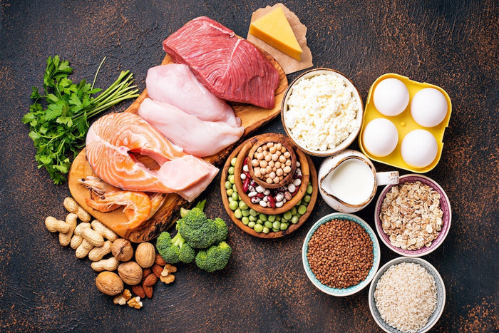  Healthy foods rich in riboflavin vitamin B2 including fish, eggs, dairy, nuts, beans, and green vegetables.