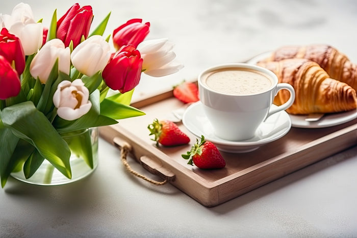 morning cup of coffee with flowers and croissant